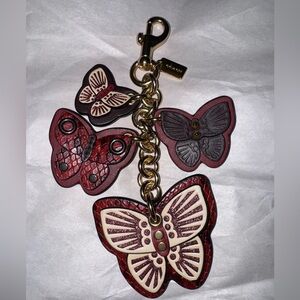 ❌❌❌SOLD❌❌❌.   NWOT Coach Butterfly Cluster Charm Oxblood